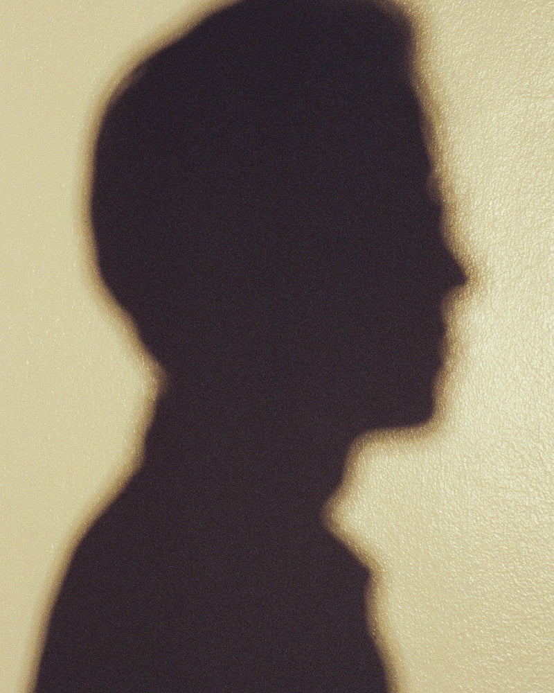 Shadow of a person on a beige background